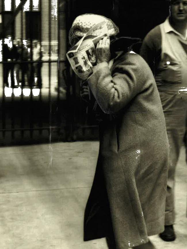 Dulcie Bodsworth shields her face from the press in 1964. Picture: Daily Mirror.