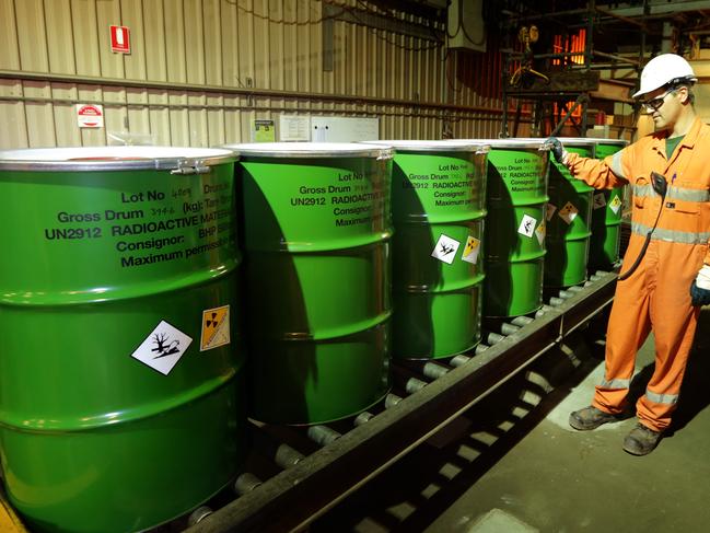 Adrian Boulton checks the packaged barrels of Uranium at BHP Billiton's Olympic Dam project in South Australia. The mine produces Copper, Gold, Silver & Uranium.