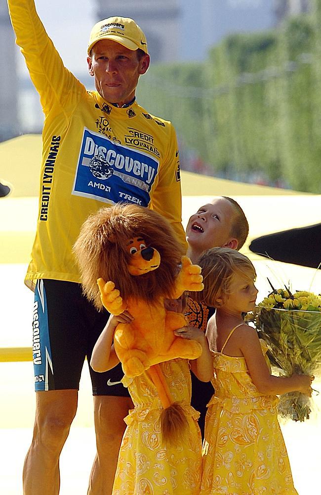 Armstrong on the podium with his three children in 2005.