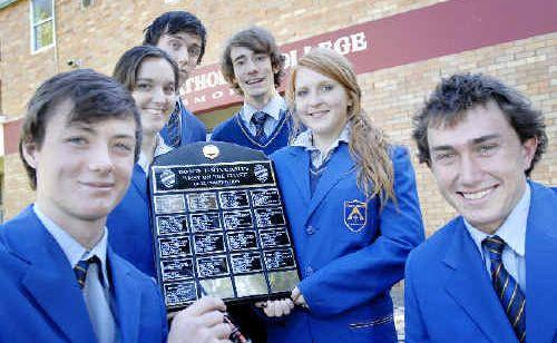 TOP TEAM: Trinity Catholic College students (from left) Thomas Whelan-Young, Julia Wilson-Bald, Nick Davis, Marley Berry-Pearce, Hannah Davis-Glencross and Torrington Callan with the Bond University Best on the Coast quiz competition shield. Picture: Jay Cronan