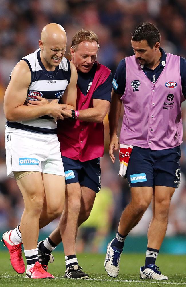 Ablett limps off with a shoulder injury. Picture: Sarah Reed