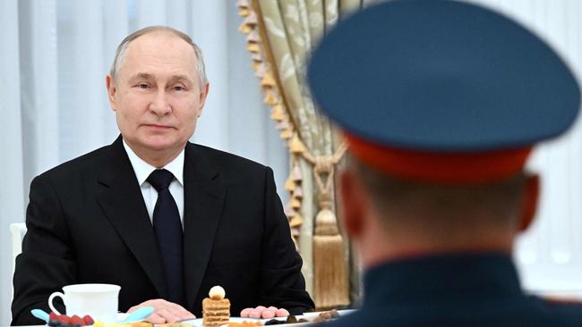 President Vladimir Putin meets Russian servicemen at the Kremlin in Moscow at the weekend. Picture: AFP