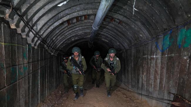 Israeli soldiers in Hamas tunnel used to attack Israel through the Erez border crossing on October 7. Picture: AFP