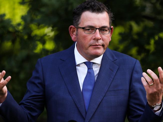 MELBOURNE, AUSTRALIA - FEBRUARY 04: Premier of Victoria Daniel Andrews speaks and makes a gesture during a Press conference at Victorian Parliament House on February 04, 2021 in Melbourne, Australia. Victoria has reintroduced COVID-19 restrictions after a hotel quarantine worker tested positive for coronavirus on Wednesday. The positive case was from one of the Australian Open quarantine hotels, with some 600 Australian Open players, officials and support staff told to isolate and get tested. All tennis matches at Melbourne Park on Thursday have been called off. Masks are now mandatory indoors across Victoria with gatherings now limited to 15 people in a household while the 75 percent return to work plan, scheduled to begin on Monda has been paused. (Photo by Asanka Ratnayake/Getty Images) *** BESTPIX ***