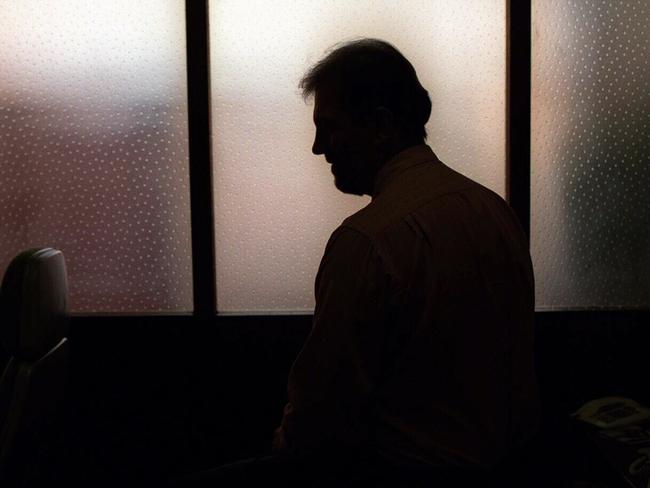 Generic image. Silhouette of a man (parent of) a sex abuse victim in an office. wrongly accused of touching young girl. Child sexual abuse. sex crime incest paedophilia.