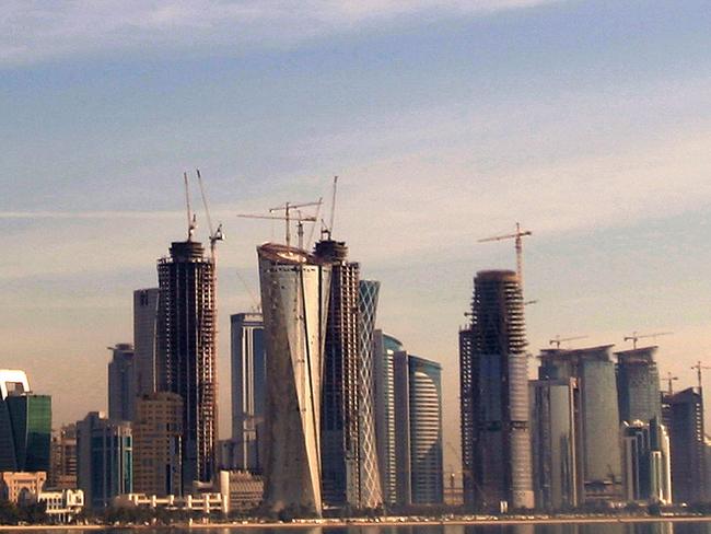 (FILES) This file photo taken on March 09, 2009 shows the cityscape of the Qatari capital Doha. Gulf states on June 5, 2017 cut diplomatic ties with neighbouring Qatar and kicked it out of a military coalition, less than a month after US President Donald Trump visited the region to cement ties with powerhouse Saudi Arabia. / AFP PHOTO / KARIM JAAFAR