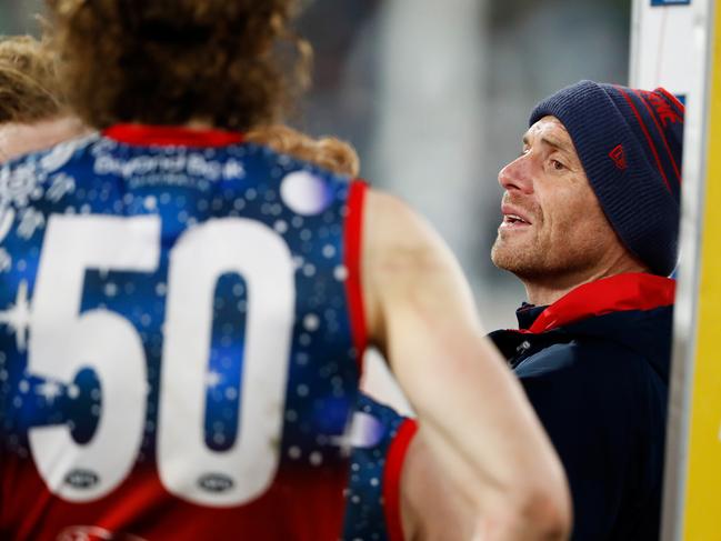 Dees coach Simon Goodwin speaks to his charges. Picture: AFL Photos/Getty Images