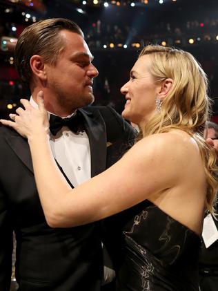 Kate Winslet congratulates Leo on his win. Picture: Christopher Polk/Getty Images