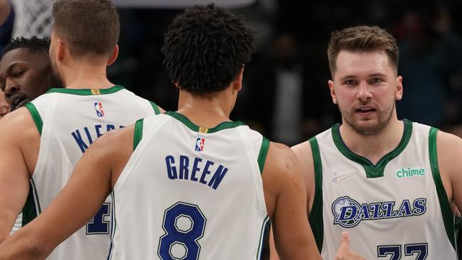 Green celebrates with Luka Doncic. Picture: Glenn James / NBAE via Getty Images