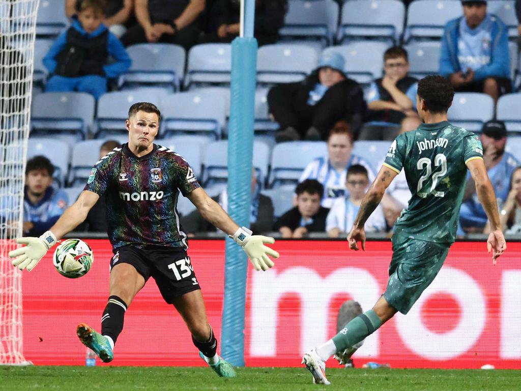 Brennan Johnson (right) scores for Spurs against Coventry. (Photo by Darren Staples/AFP)