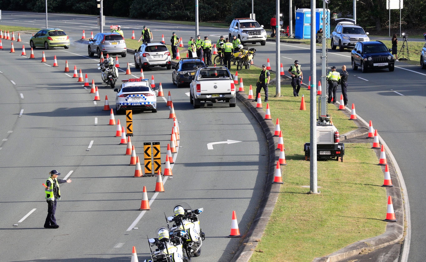 Queensland Police set up a road block due to the Corona Virus at the NSW / Queensland Border on the old Pacific Highway at Coolangatta. Photo: Scott Powick Newscorp