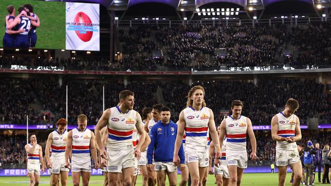 The Bulldogs leave the field after another defeat in a final at Perth Stadium in which they led for significant parts of the game. Picture: Getty Images