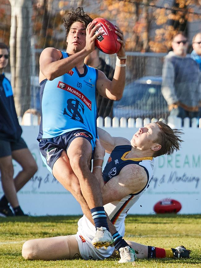 Sturt's Shane McAdam is tackled by Adelaide's James Loneragan at Unley Oval. Picture: matt Loxton/AAP