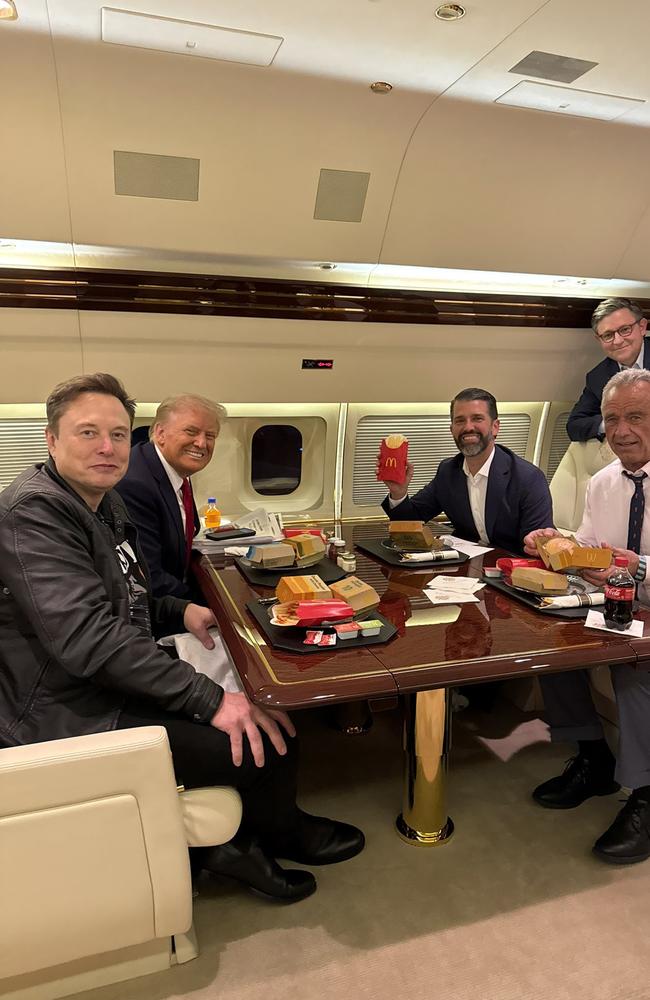 Donald Trump, Elon Musk, Donald Trump Jnr, Robert F Kennedy Jnr, seen onboard the Trump private plane, eating McDonalds. Picture: X