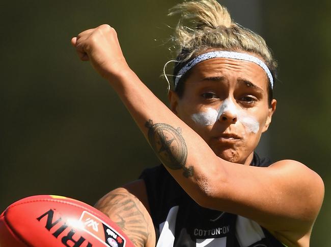 MELBOURNE, AUSTRALIA - MARCH 18:  Moana Hope of the Magpies handballs during the round seven AFLW match between the Collingwood Magpies and the Adelaide Crows at Olympic Park on March 18, 2018 in Melbourne, Australia.  (Photo by Quinn Rooney/Getty Images)