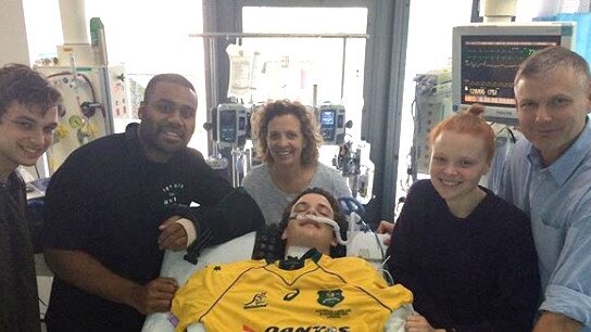 Conor Tweedy with his family and Samu Kerevi