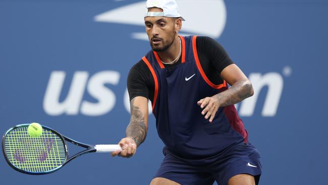 Nick Kyrgios of Australia plays a forehand against Benjamin Bonzi