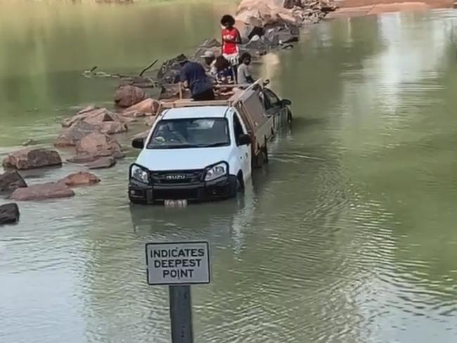 Seven people had to be rescued from Cahills Crossing after their car flooded and stalled leaving them stranded. Picture: Alf Lang