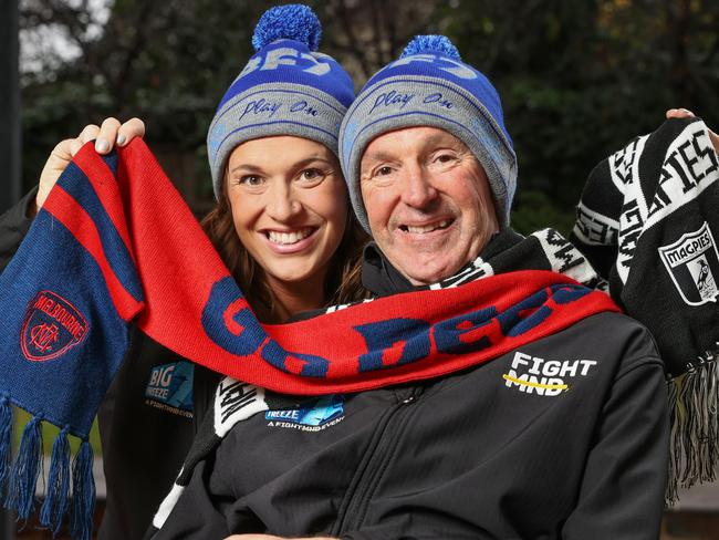 Neale Daniher is urging Victorian's to get behind this year's FightMND Big Freeze. The slide will again be at the MCG this year, while the game between Melbourne and Collingwood will be played in Sydney. Neale Daniher with daughter Bec Daniher with Melbourne and Collingwood scarves for the FightMND Big Freeze game.                       Picture: David Caird