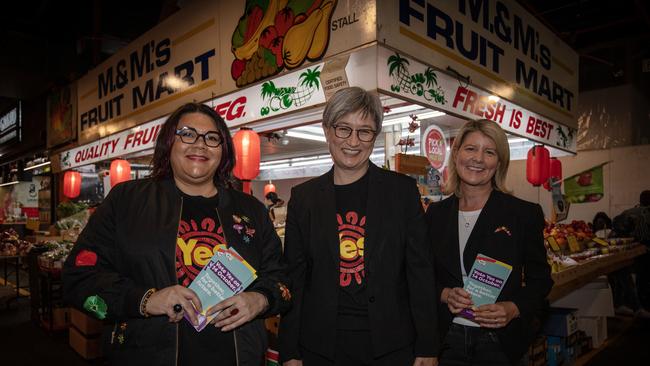 Foreign Minister Penny Wong, former Senator Natasha Stott Despoja and Yes campaigner Khatija Thomas hand out how to votes in Adelaide. Picture: NCA Newswire / Emma Brasier