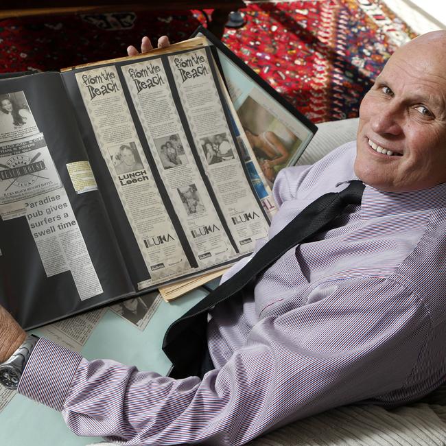 Former owner of Billy's Beach House, Bill James, looking over old records and photo albums of the good olds. The Beach House has now been demolished.