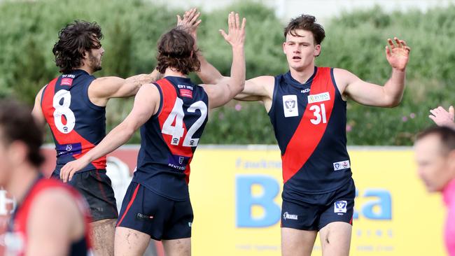 (From left) Tom Silvestro, Marcus Lentini and Aaron Clarke celebrates a goal. Picture: George Salpigtidis