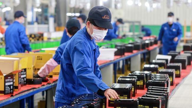 An employee working on a battery production line at a factory in Huaibei in China's eastern Anhui province. Picture: STR / AFP.