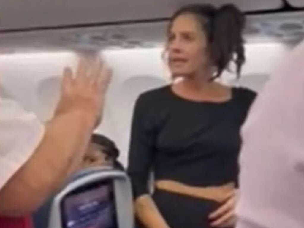 The woman threw a bottle at a passenger after she was asked to leave the flight. Picture: Reddit