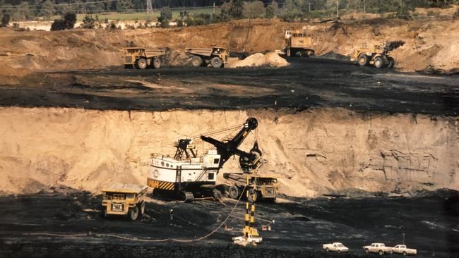 BEFORE: The Yancoal-operated Premier Coal mine pit has now been filled in to create a recreational watercourse, below