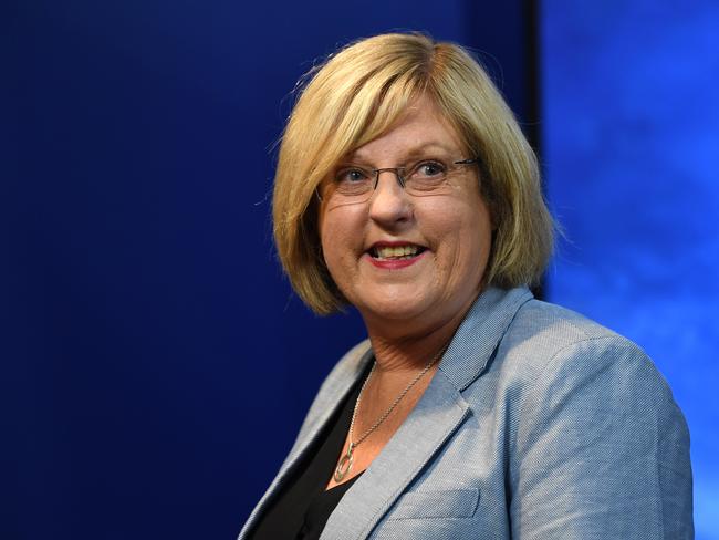 Victorian Police Minister Lisa Neville departs a press conference in Melbourne, Tuesday, March 31, 2020. Stage three social isolation measures commence in Victoria today. (AAP Image/James Ross) NO ARCHIVING