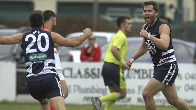 Noarlunga’s captain Tom Caudle celebrates a goal with teammate Reece Martell during the side’s win over Flagstaff Hill on Saturday. Picture: AAP/Dean Martin