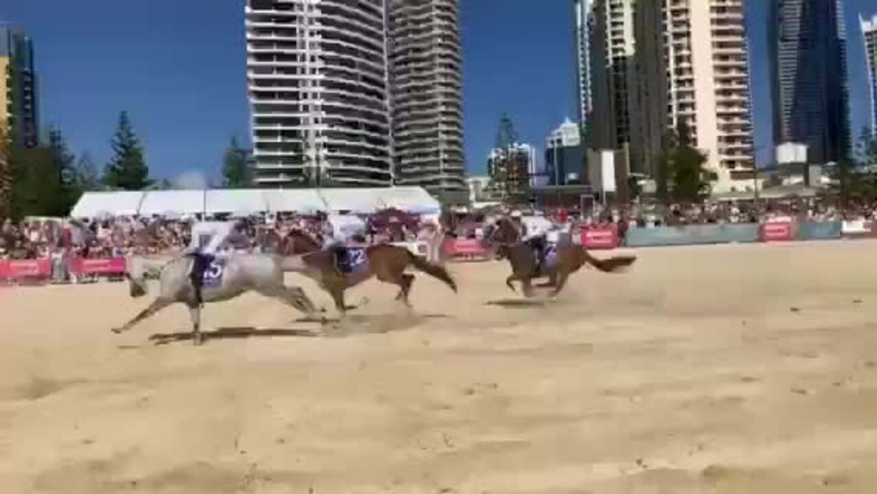 Hundreds flock to iconic Magic Millions beach gallop