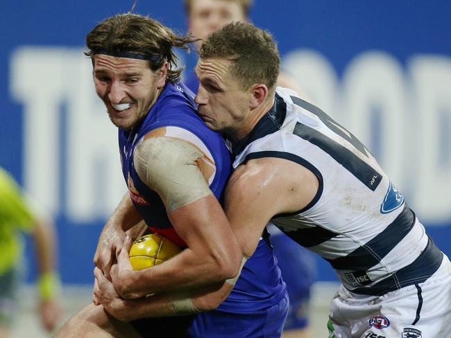 Marcus Bontempelli is tackled by Joel Selwood last year at Simonds Satdium. Picture: Michael Klein