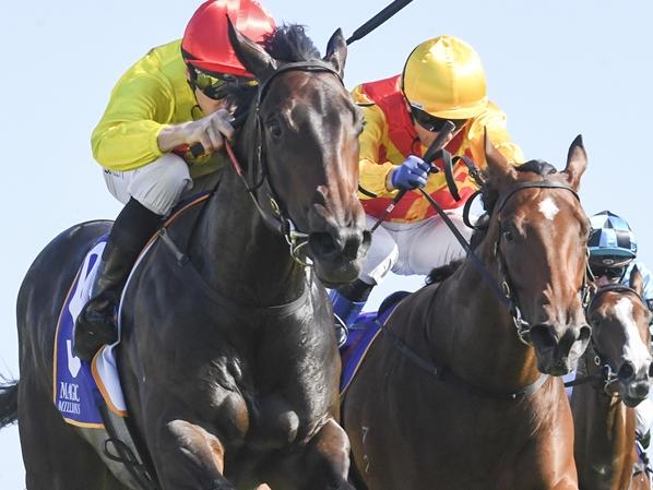 O' Ole (red cap) wins 2024 Magic Millions 2YO Classic from Memo (yellow cap), Horsehoe Hill (outside) and Tempestuous (rails) Picture: Bradley Photos