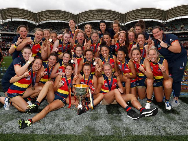 The Crows pose for a photograph with the premiership cup after winning the 2019 AFLW Grand Final between the Adelaide Crows and the Carlton Blues at Adelaide Oval. Picture: Michael Willson/AFL Photos