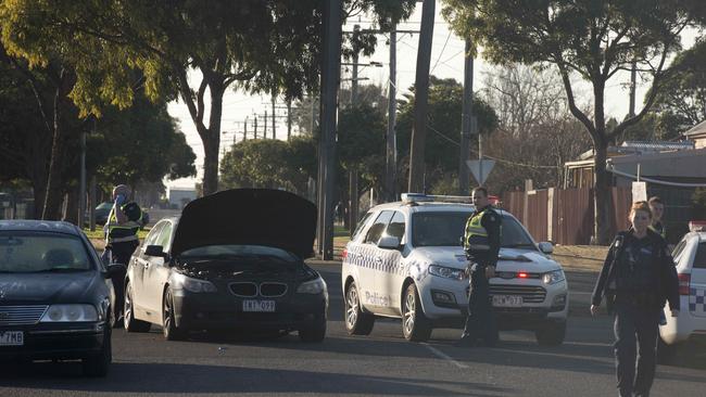 Authorities with the vehicle after it was dumped.