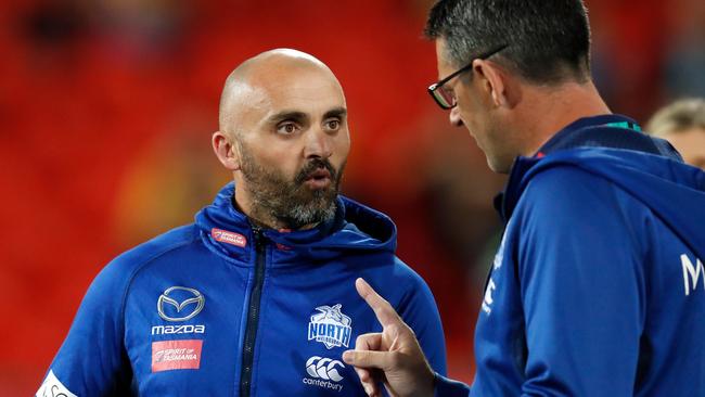 North Melbourne coach Rhyce Shaw chats to assistant Jade Rawlings this season.