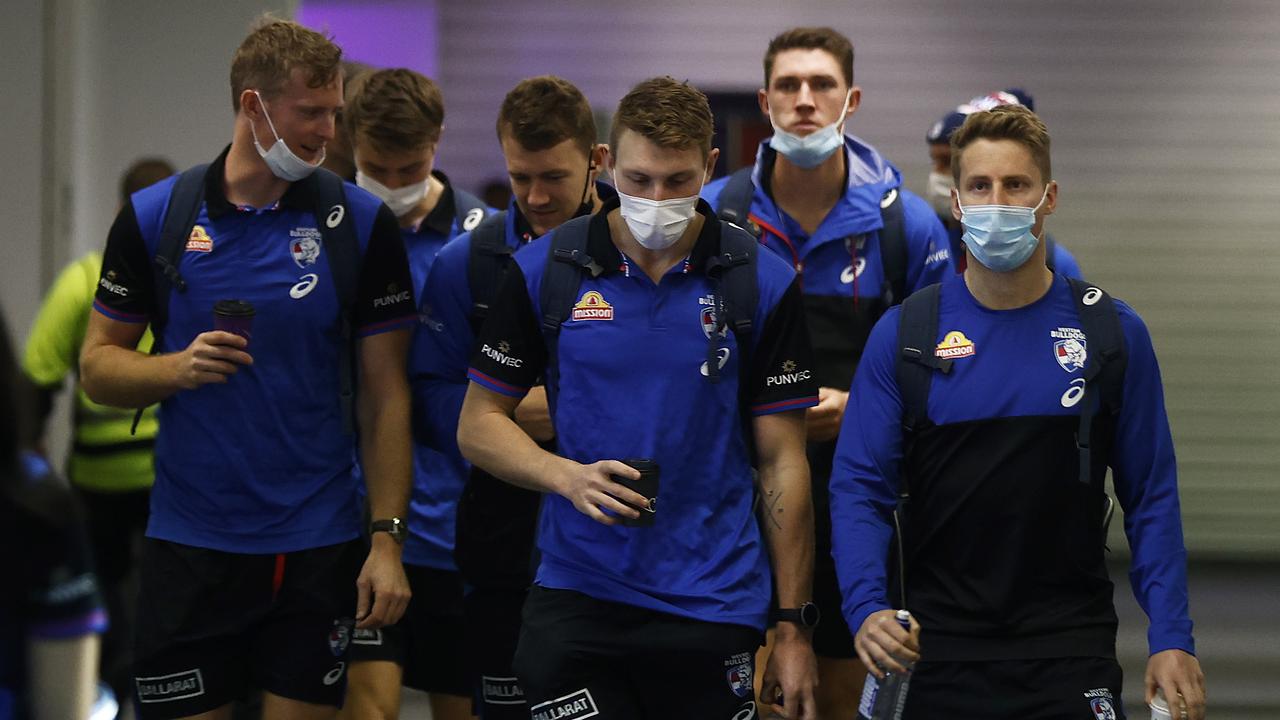 Western Bulldogs players masked up at the airport. Picture: Getty Images