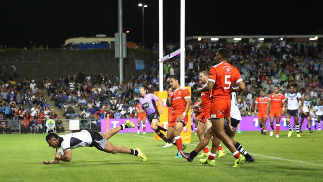 Tyrone Phillips, of Fiji, scores during a game against Tonga Mate Ma'a.