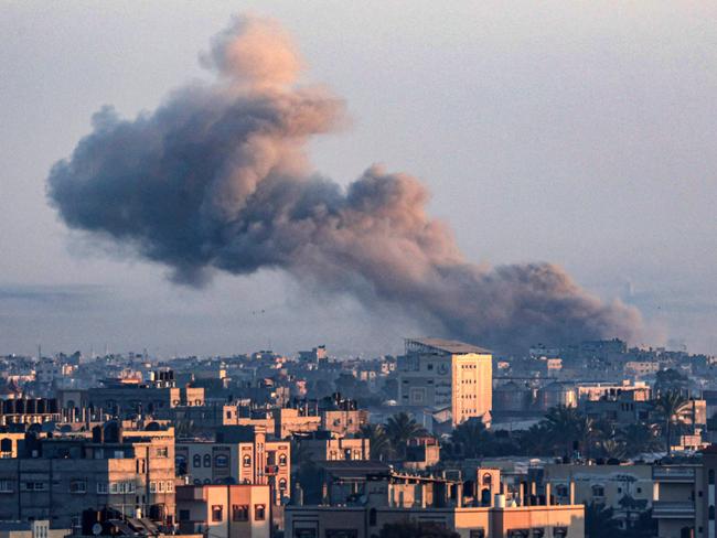 A picture taken from Rafah shows smoke billowing over Khan Yunis in the southern Gaza Strip during Israeli bombardment on December 30, 2023. Picture: AFP