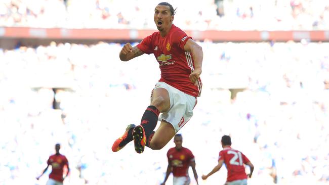 TOPSHOT - Manchester United's Swedish striker Zlatan Ibrahimovic celebrates scoring their second goal during the FA Community Shield football match between Manchester United and Leicester City at Wembley Stadium in London on August 7, 2016. / AFP PHOTO / GLYN KIRK / NOT FOR MARKETING OR ADVERTISING USE / RESTRICTED TO EDITORIAL USE