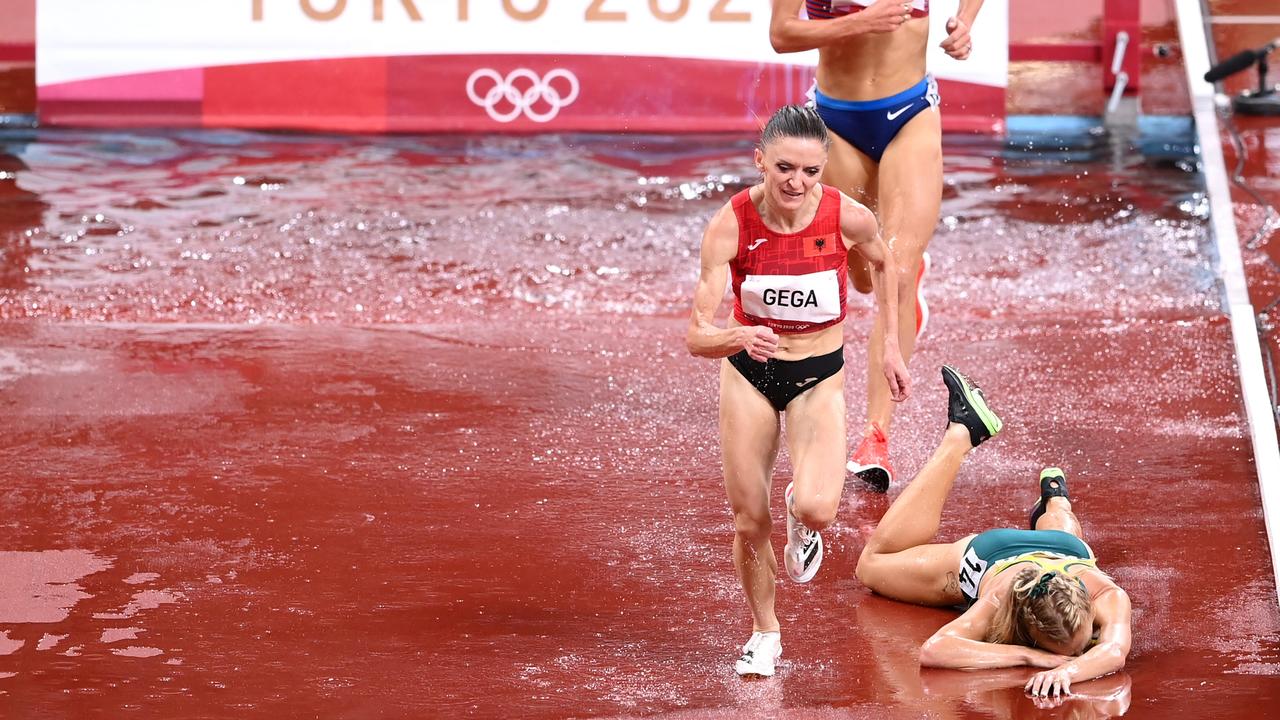 Athletes run past Gregson after her fall. Picture: Matthias Hangst/Getty Images