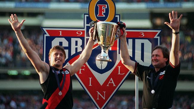 Captain Mark Thompson and coach Kevin Sheedy hold up the 1993 Premiership Cup.