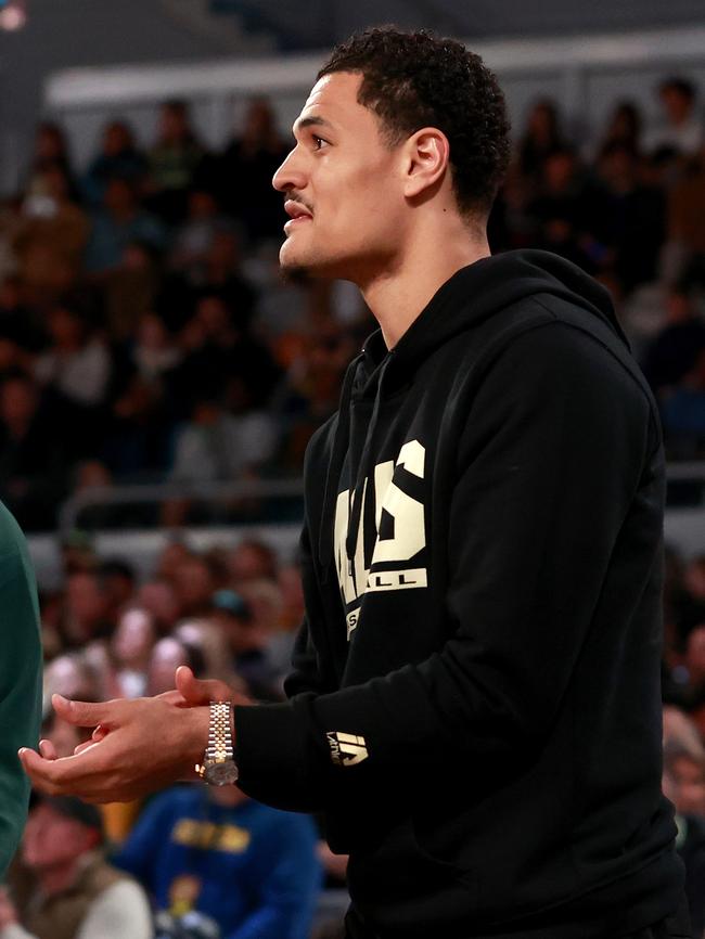 Green watches his teammates smack China on Tuesday night. Picture: Getty Images