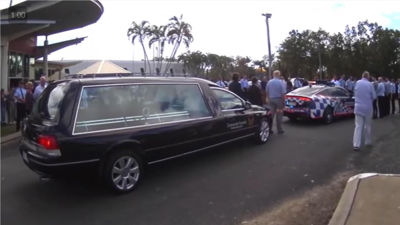 Attendees, including many QPS officers, formed a guard of honour following the service. Picture: Screenshot of livestream by Atherton Community Funerals