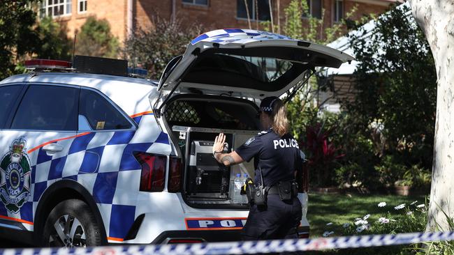 Police in the Stretton street where a major crime scene has been established. Picture: Nigel Hallett