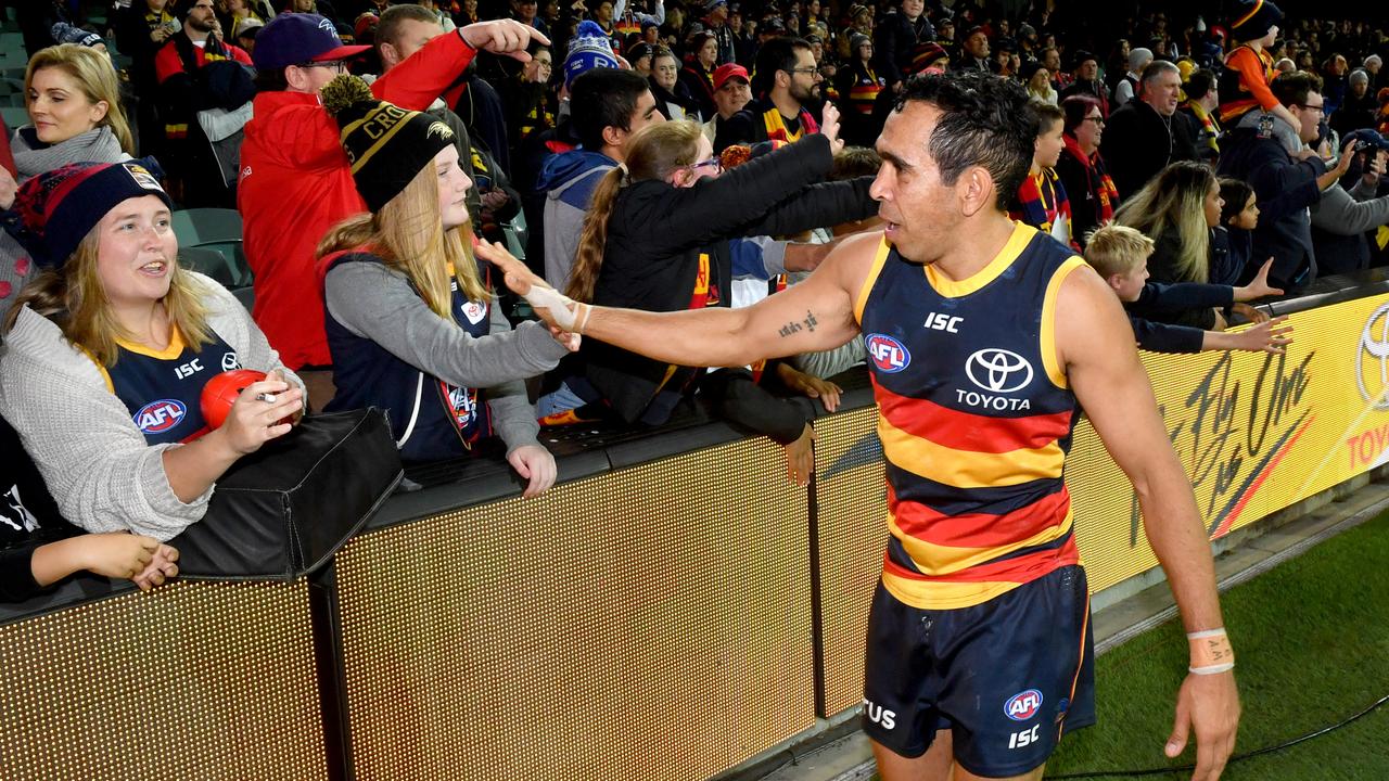 Eddie Betts celebrates with fans after a Crows win in 2019. Picture: AAP