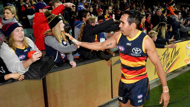 Eddie Betts celebrates with fans after a Crows win in 2019. Picture: AAP