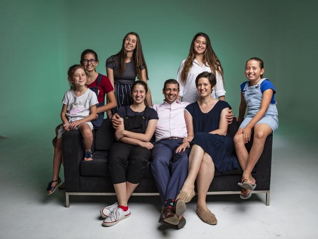 Parenting expert Justin Coulson with wife Kylie and their six daughters. Picture Mark Cranitch