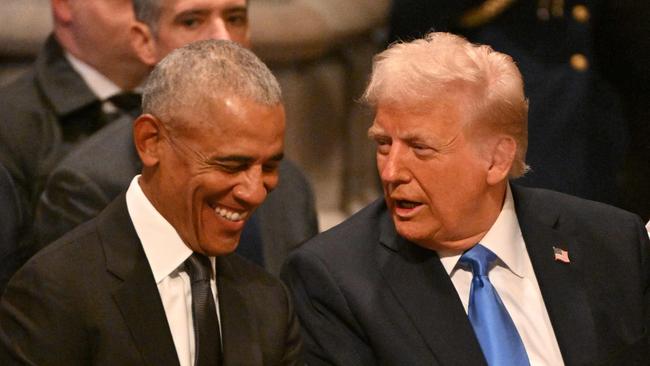 TOPSHOT - Former US President Barack Obama speaks with President-elect Donald Trump before the State Funeral Service for former US President Jimmy Carter at the Washington National Cathedral in Washington, DC, on January 9, 2025. (Photo by ROBERTO SCHMIDT / AFP)